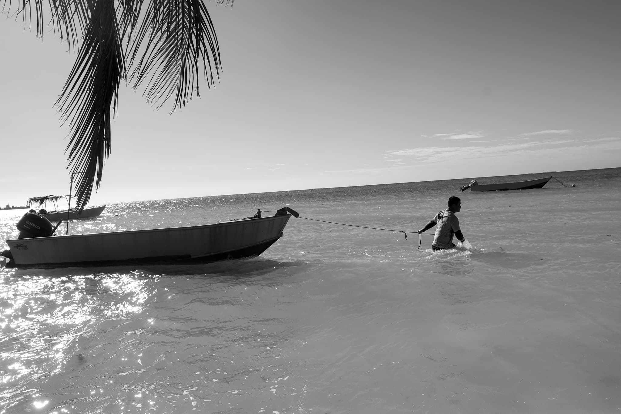 Tuvalu fisherman bringing in his boat